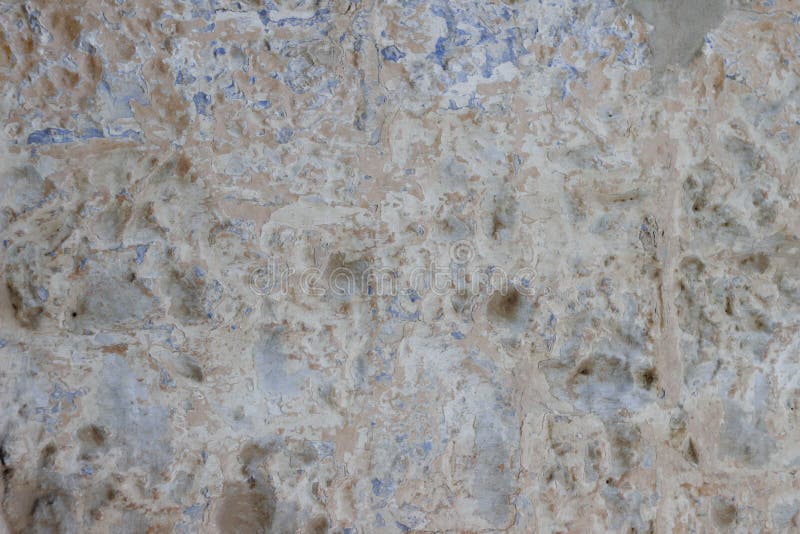 Stone Wall with a Multilayered Old Tumbling Whitewash Texture Stock