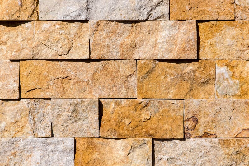 Stone wall from tiles natural granite.