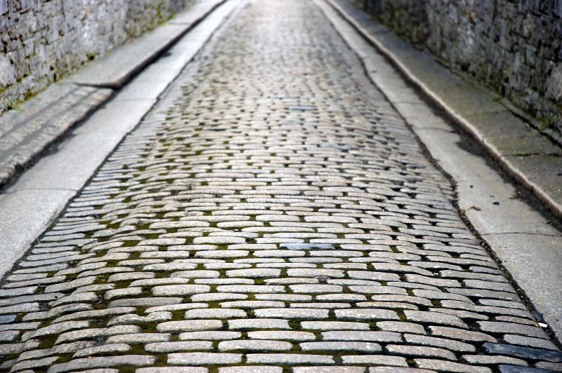 Stone walled cobbled street stock images Stone walled cobbled street stock images