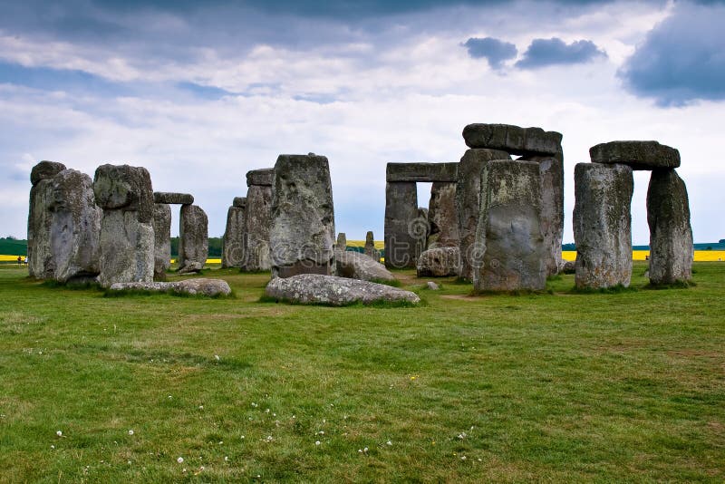 Stonehenge is a prehistoric monument located in the English county of Wiltshire. One of the most famous sites in the world. It is at the centre of the most dense complex of Neolithic and Bronze Age monuments in England, including several hundred burial mounds.