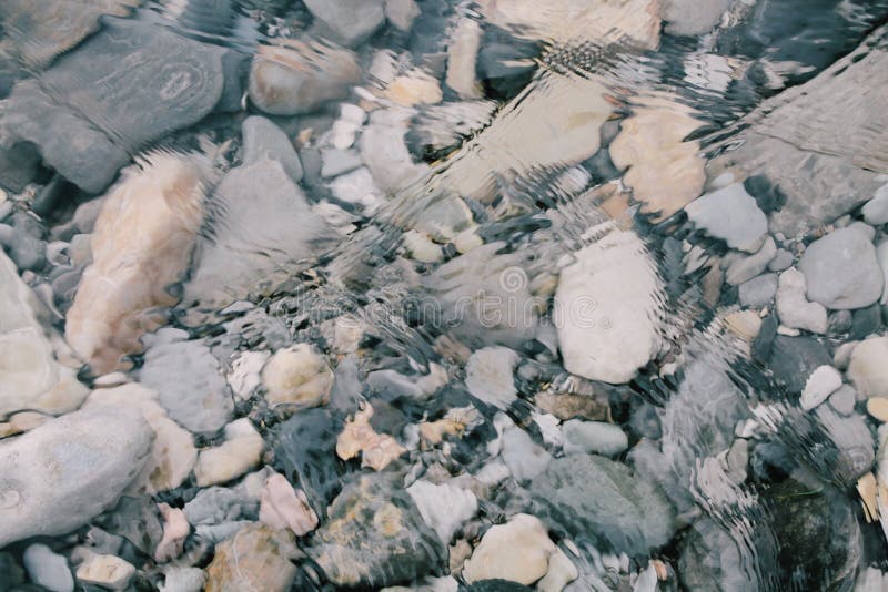 Stones at the bottom of a transparent river royalty free stock image Stones at the bottom of a transparent river royalty free stock image