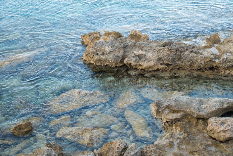 Stones Stick Out of Sea Water Stock Image - Image of vacation, stone ...