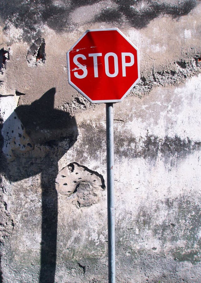 Street sign stop and old wall surface