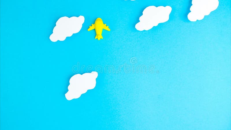 Stop motion animation. Three planes of yellow blue and pink colors are flying against the background of clouds blue sky stock video