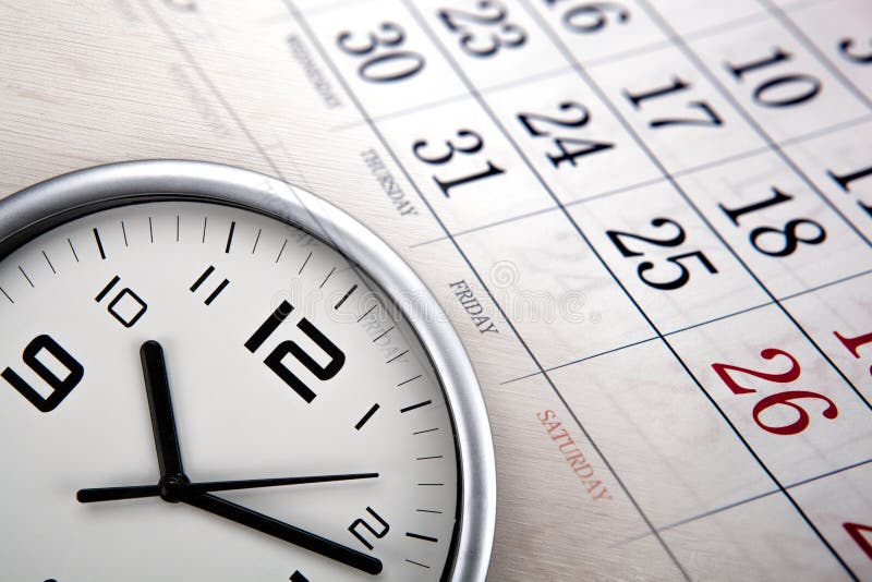 Large white clock face with calendar sheets closeup. Large white clock face with calendar sheets closeup
