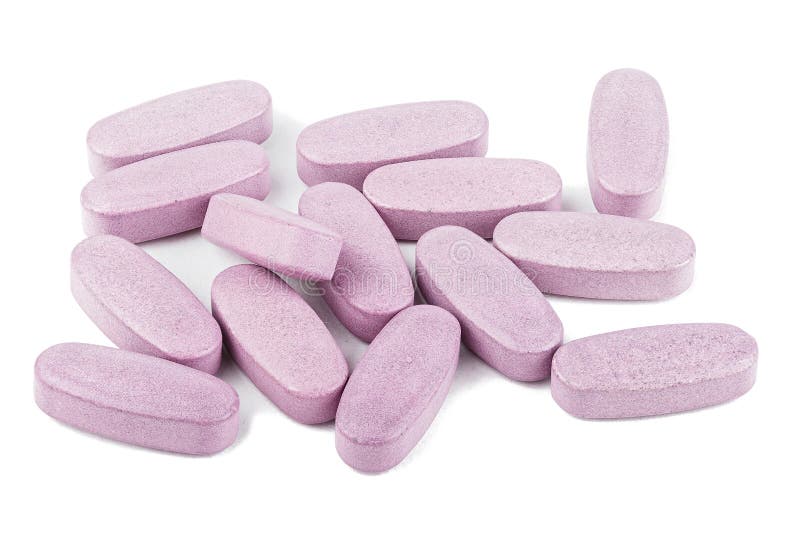 Stora rosa minnestavlor. Stora rosa preventivpillerar spridde på vit bakgrund som isolerades