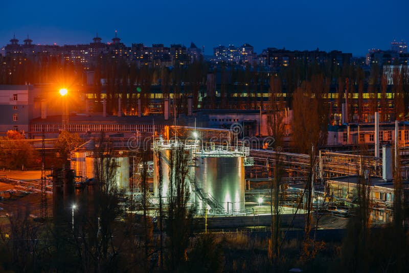 Storage tanks in chemical factory at night royalty free stock images