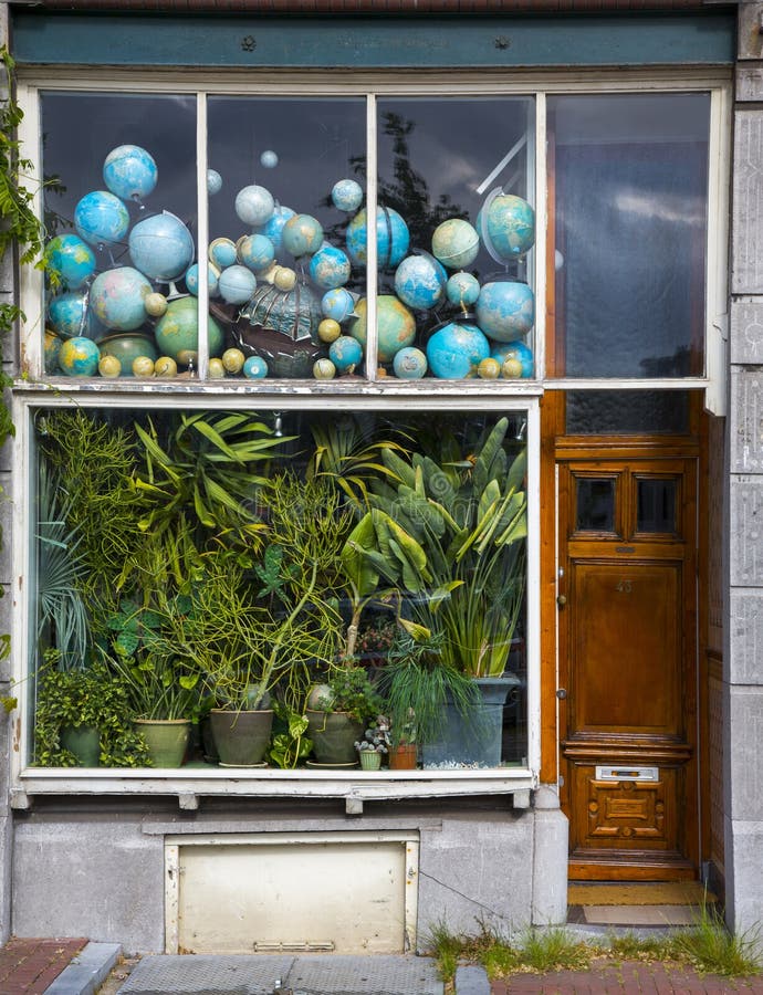 Storefront with Globes and Flowers Stock Image Image of store, globe