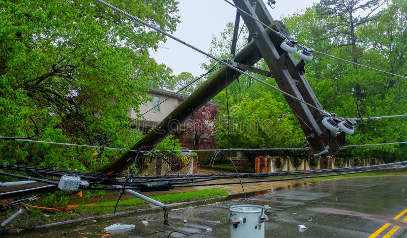 The Storm Caused Severe Damage To Electric Poles Falling Tilt. Stock Image - Image of concrete, outdoors: 116919879