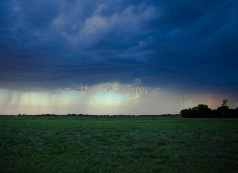 Threatening thunderclouds and rain darken the skies as severe weather approaches. Threatening thunderclouds and rain darken the skies as severe weather approaches.