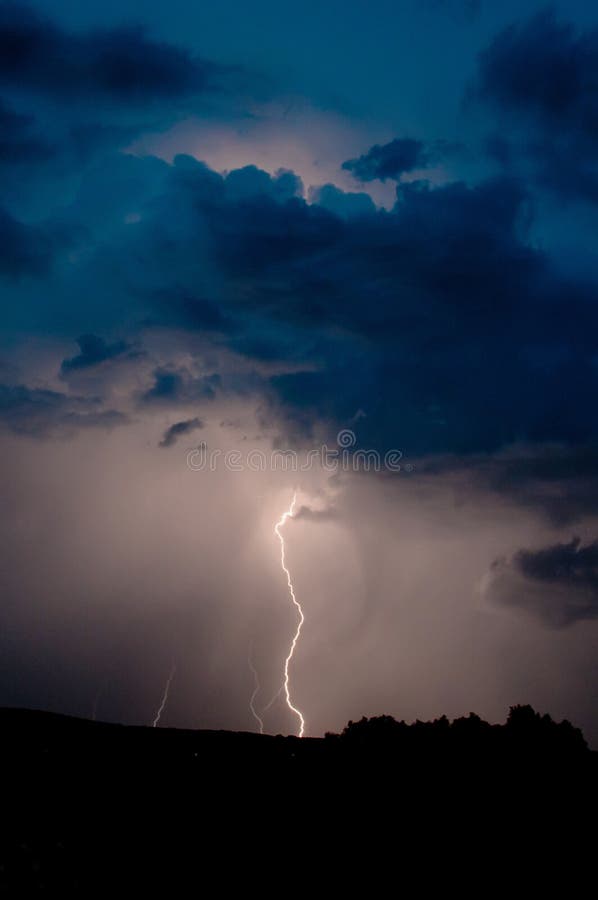 Storm on a dark blue sky stock photo