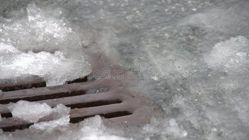 storm-drain-snow-slush-close-up-k-uhd-co