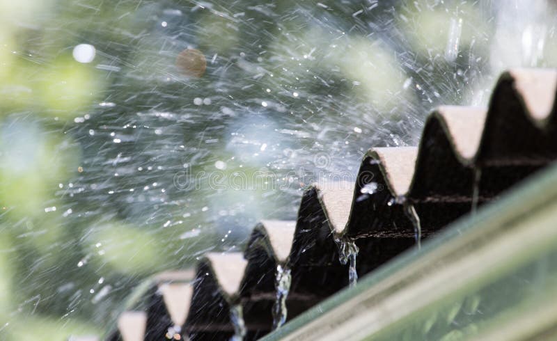 Storm rain on the roof of the house. Czech, detail.