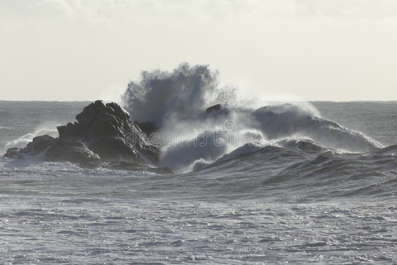 Stormy sea waves crashing over cliffs from northern portuguese coast. Soft backlit. Stormy sea waves crashing over cliffs from northern portuguese coast. Soft backlit