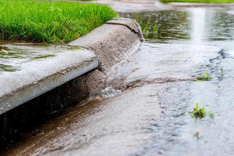 Stormwater Flowing into Street Intake Drain after a Rainstorm Stock ...