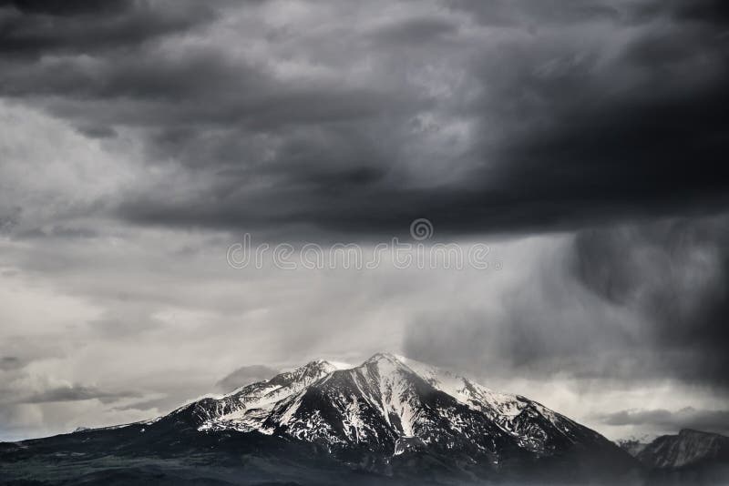 Dangerous stormy weather for snow sking is rolling in over Mt Sopris in Colorado. This famous mountain is located near Aspen Colorado and is a prime vacation spot in the United States Rocky Mountain Range. Dangerous stormy weather for snow sking is rolling in over Mt Sopris in Colorado. This famous mountain is located near Aspen Colorado and is a prime vacation spot in the United States Rocky Mountain Range.