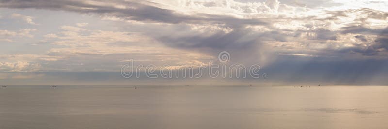 Stormy sky with sun rays piercing the clouds royalty free stock photos