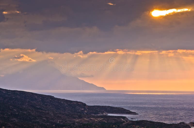 Stormy sky and sunrise at holy mountain Athos