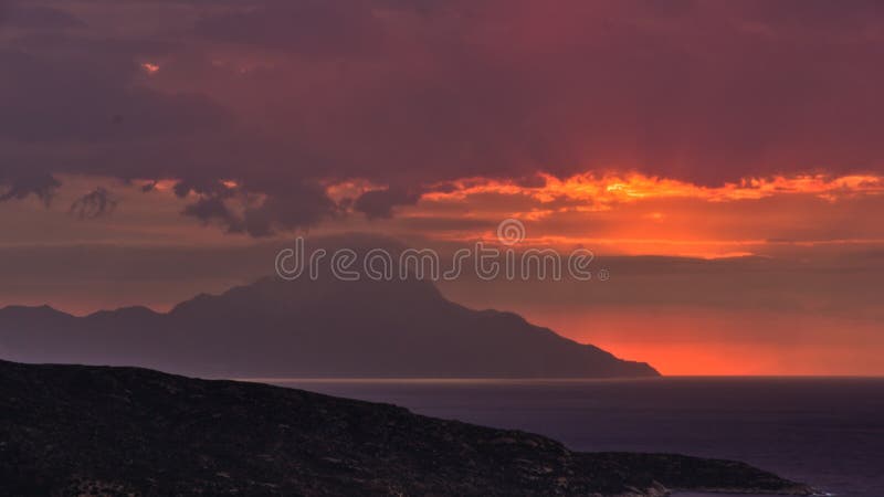 Stormy sky and sunrise at holy mountain Athos