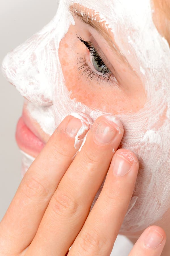 Applying mask fingers young girl beauty treatment skin purity. Applying mask fingers young girl beauty treatment skin purity