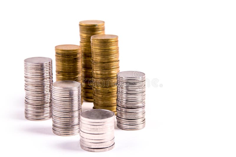 Stosy złociste i srebne monety odizolowywać zdjęcia stock Stosy złociste i srebne monety odizolowywać zdjęcia stock