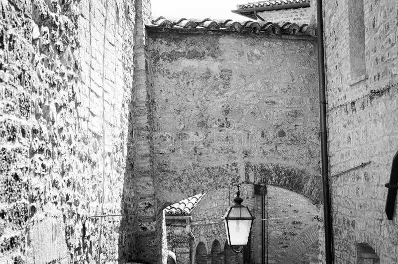 Street lantern hanging under the arch Spello, Umbria, Italy. Street lantern hanging under the arch Spello, Umbria, Italy