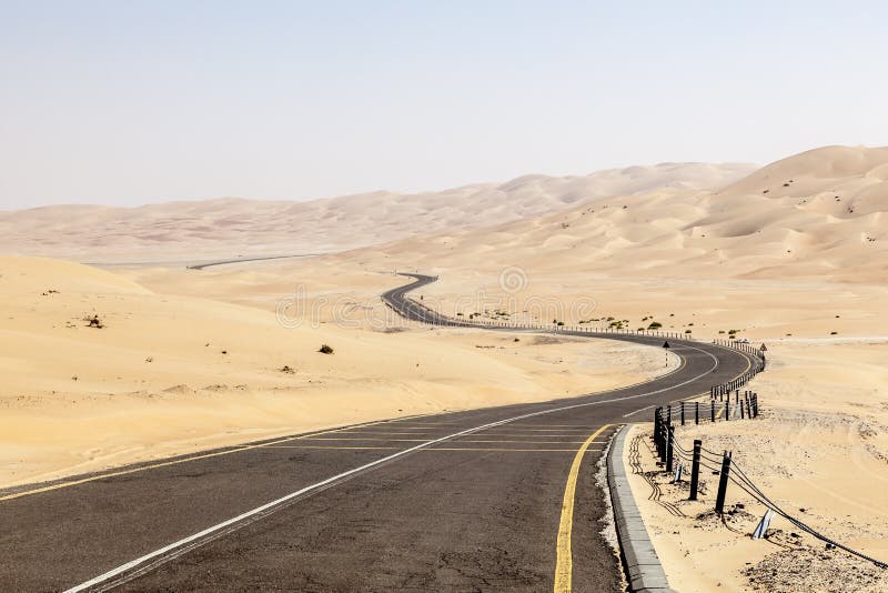 Desert road to the Moreeb Dune in Liwa Oasis area. Emirate of Abu Dhabi, United Arab Emirates. Desert road to the Moreeb Dune in Liwa Oasis area. Emirate of Abu Dhabi, United Arab Emirates