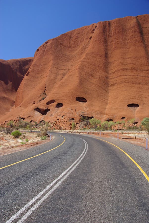 The road to Australiaâ€™s famous monolith, Uluru (Ayers Rock). Uluru â€“ Kata Tjuta National Park, Northern Territory, Australia. The road to Australiaâ€™s famous monolith, Uluru (Ayers Rock). Uluru â€“ Kata Tjuta National Park, Northern Territory, Australia.