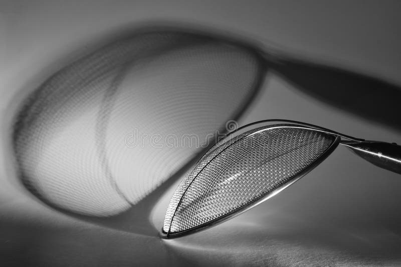 Strainer,sieve or colander,close up of kitchen tool, black and white food and drink, cooking concept,free copy space, black and royalty free stock photo