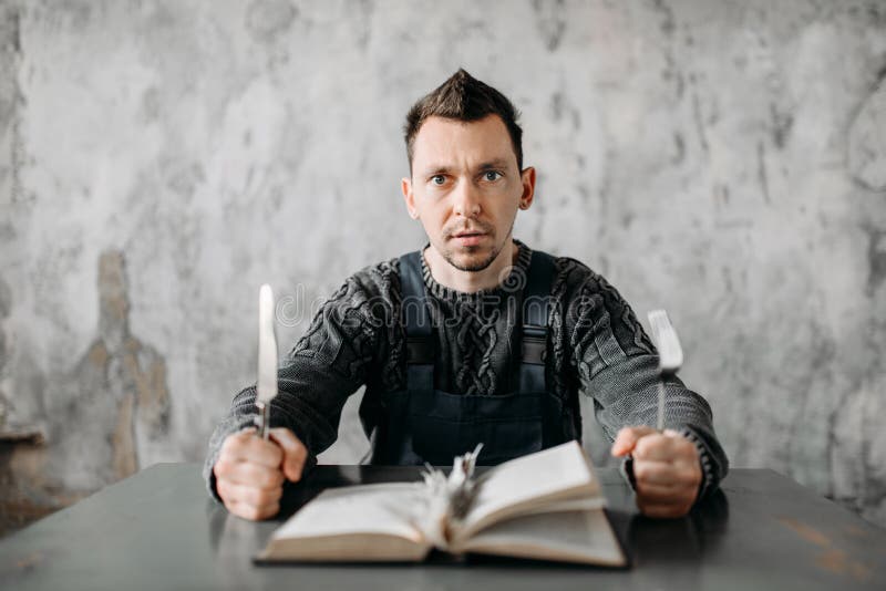 Strange freak man eats the sheets from the book