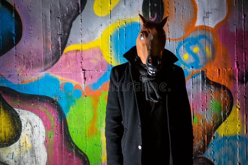 Strange man wearing a scary horse mask in night stock images Strange man wearing a scary horse mask in night stock images