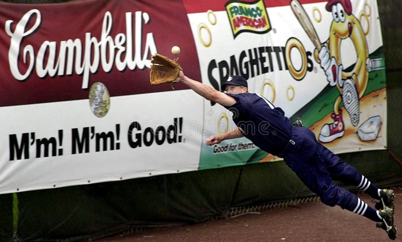 Camde Rivershark leftfielder Brad Strauss fully extends to catch a fly ball hit by Atlantic City's Keith Gordon in the first inning of May 19th 2002 game at Campbell field, Camden NJ.