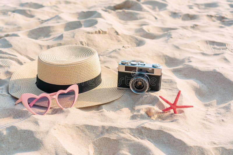 Straw Hat, Sunglasses, Coral and Camera on Sand at Tropical Beach ...