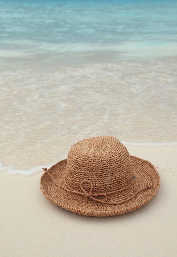 Straw hat on tropical island