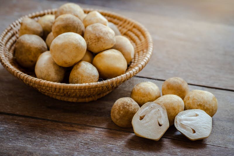 Straw mushroom on wooden table stock image