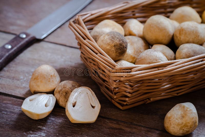 Straw mushroom on wooden table stock image