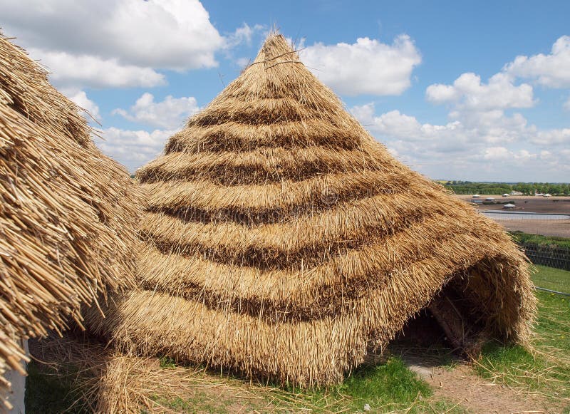 Straw thatched Neolithic houses built and reconstructed from chalk and straw daub and wheat-thatched roofing, based on archaeological remains found at Durrington Walls, near Stonehenge. Straw thatched Neolithic houses built and reconstructed from chalk and straw daub and wheat-thatched roofing, based on archaeological remains found at Durrington Walls, near Stonehenge.