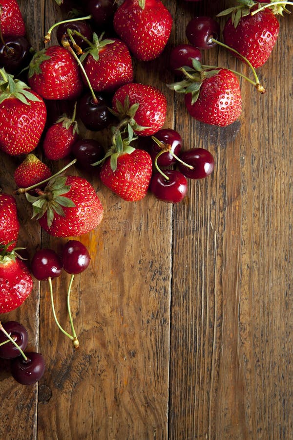 Strawberries and cherries stock image. Image of food 25127377