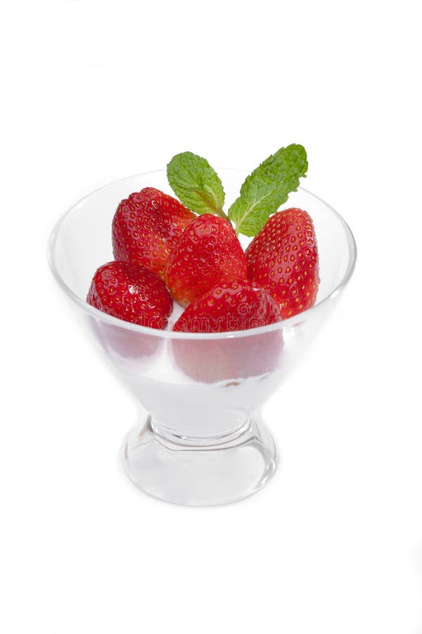 Strawberries in a cup with cream of milk