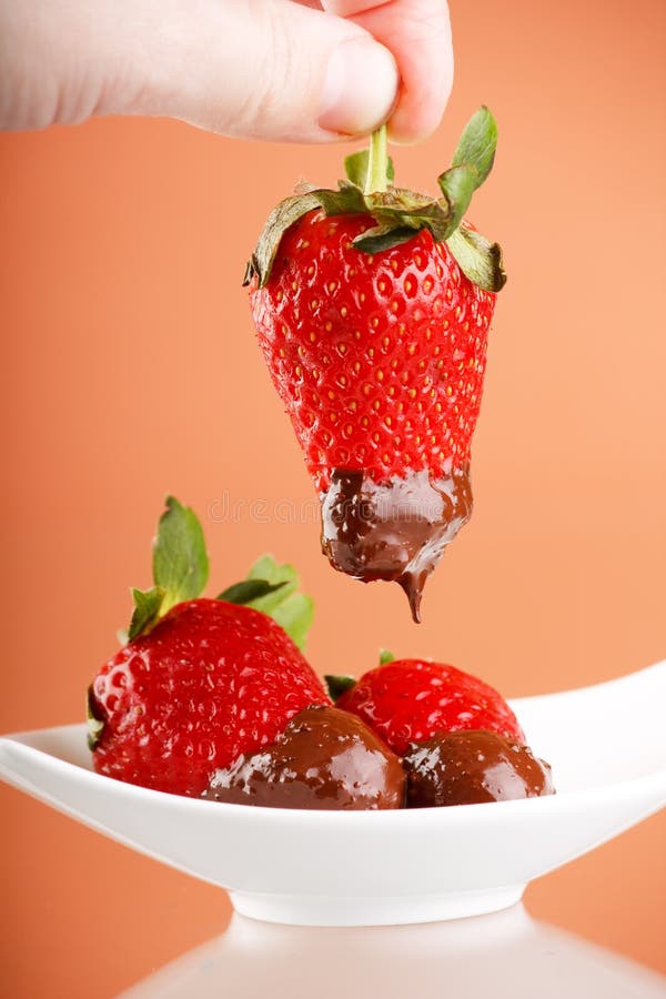 Strawberries Dipped in Melting Chocolate Stock Photo Image of macro