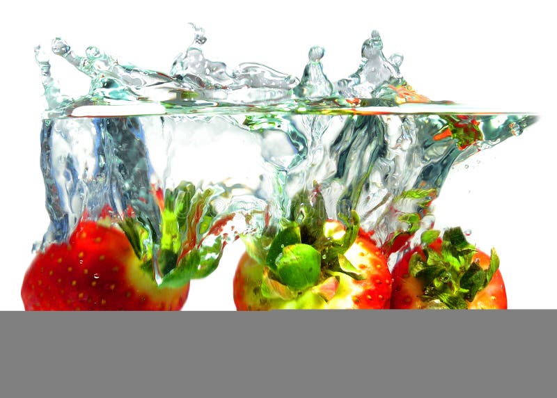 Strawberries falling in water