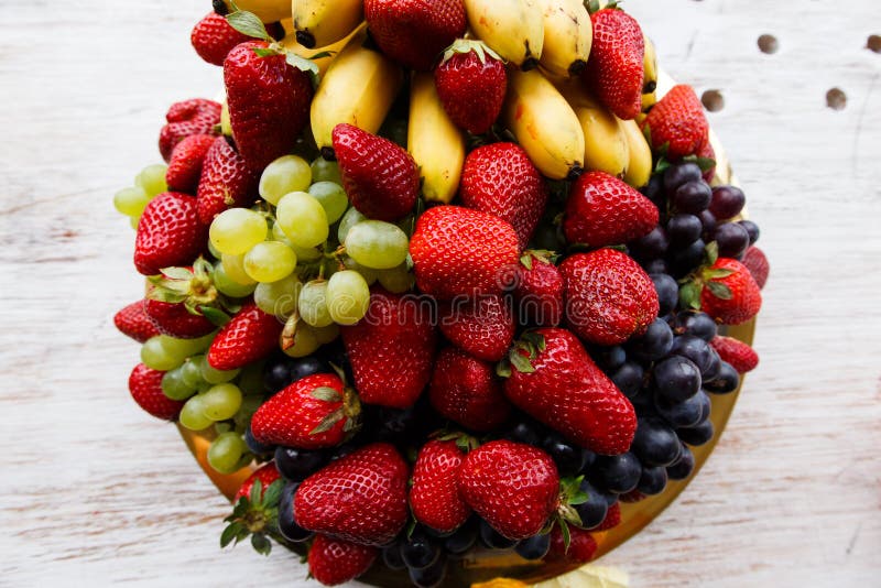 Strawberries , Grapes, Bananas on Plate Stock Image Image of