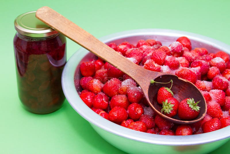 Strawberries in a Manufacturer with Sugar and Jars for Making Jam