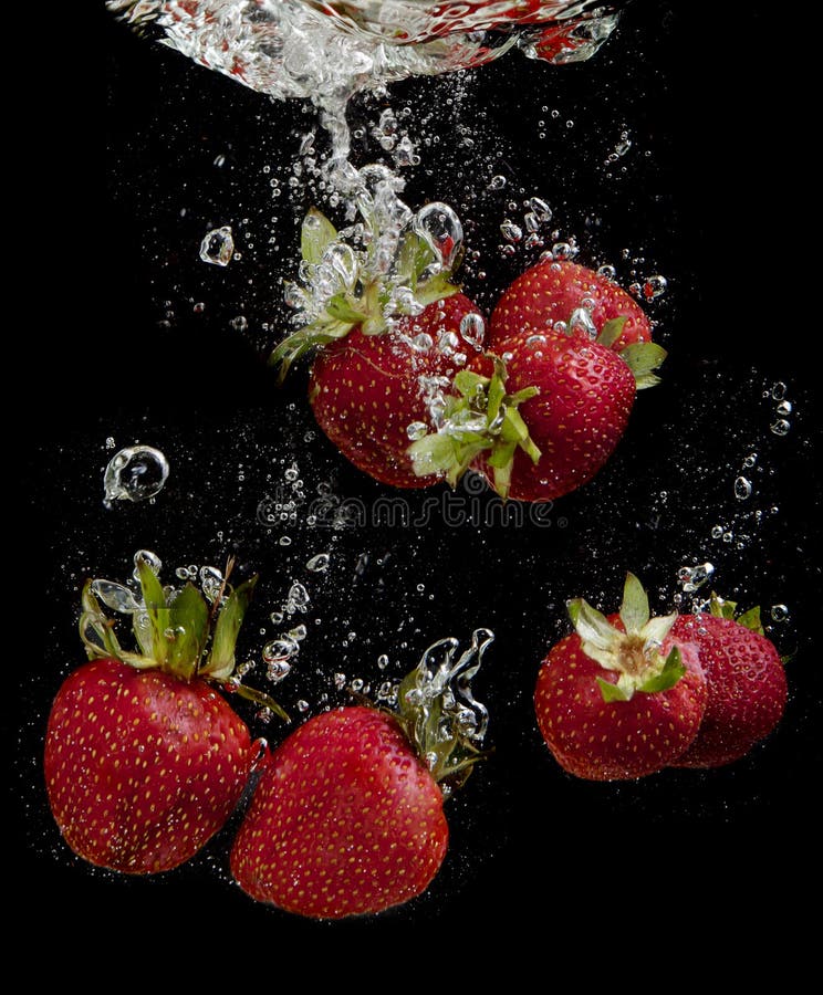 Strawberries in water stock photo. Image of fruit, action 19609356