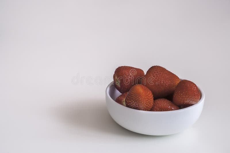 Strawberry in bowl stock photography