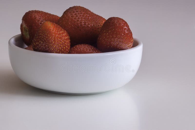 Strawberry in bowl royalty free stock photography