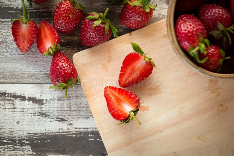 Strawberry In a bowl On a Wooden Background royalty free stock photo