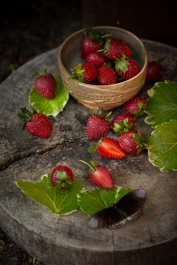 Strawberry In a bowl On a Wooden Background stock images