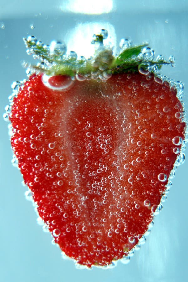 Strawberry in bubbles of air in water stock images Strawberry in bubbles of air in water stock images