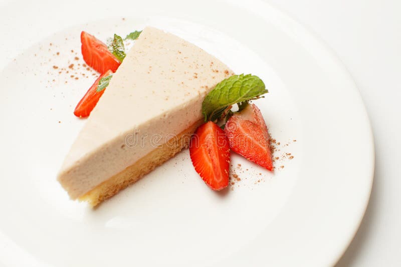 Strawberry cheesecake on a white plate stock images Strawberry cheesecake on a white plate stock images